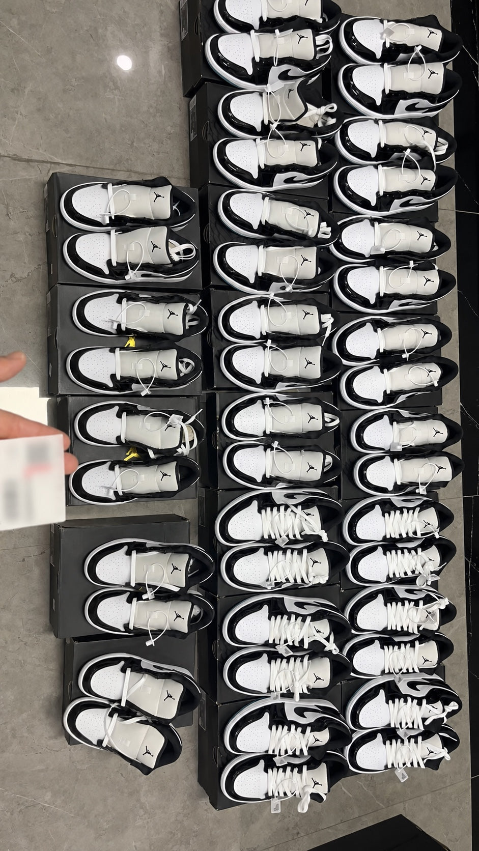 Rows of Jordan sneakers arranged on boxes for inventory inspection
