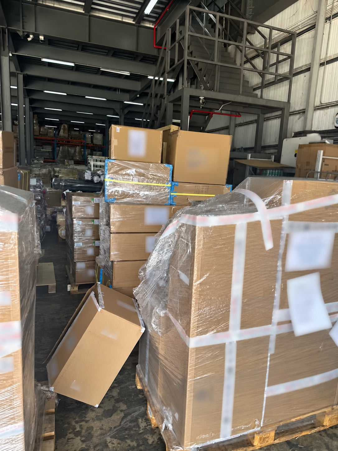 Shipping cartons stacked inside a footwear and apparel warehouse in China