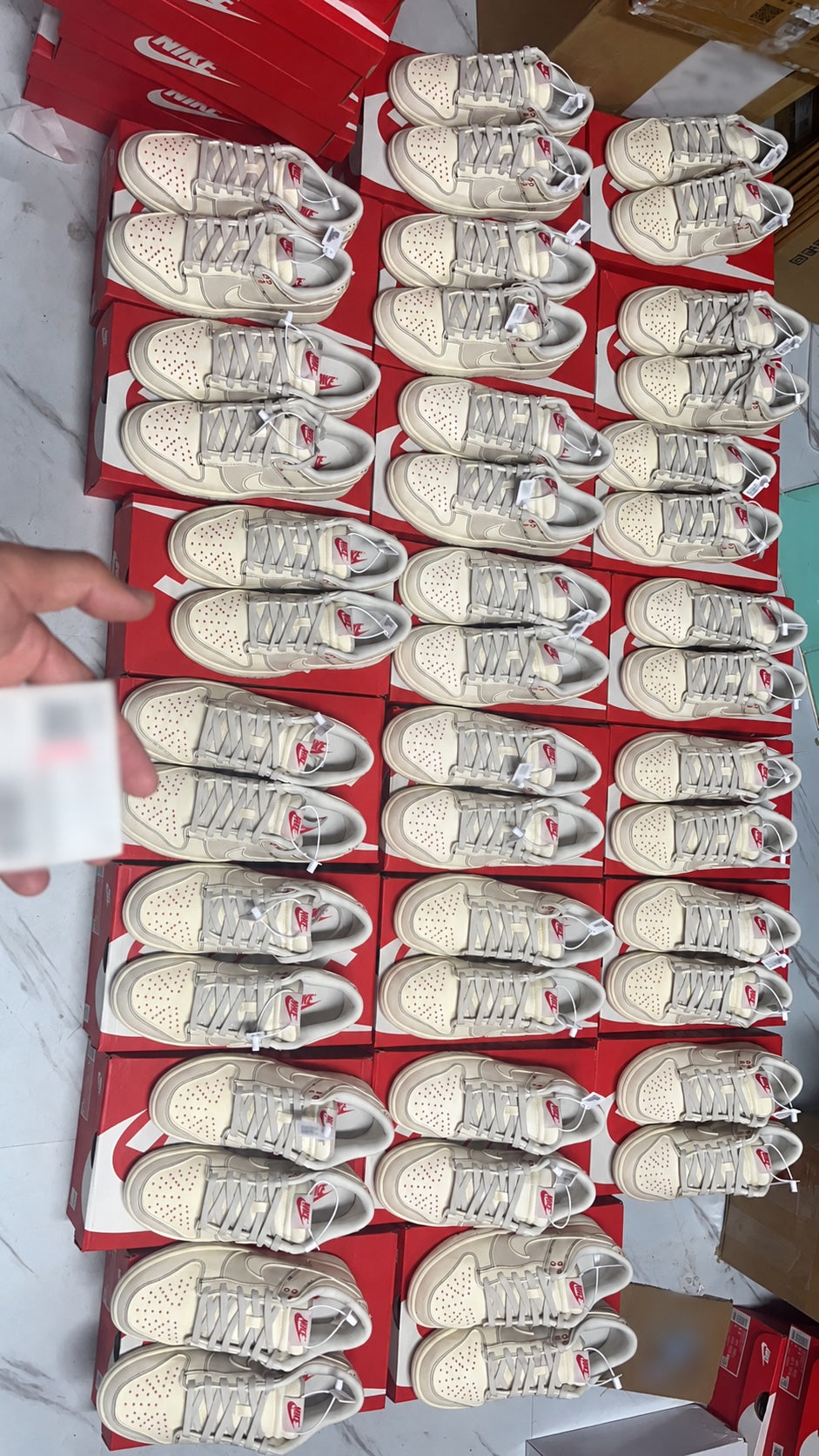 Nike sneakers displayed on shoe boxes during a product check