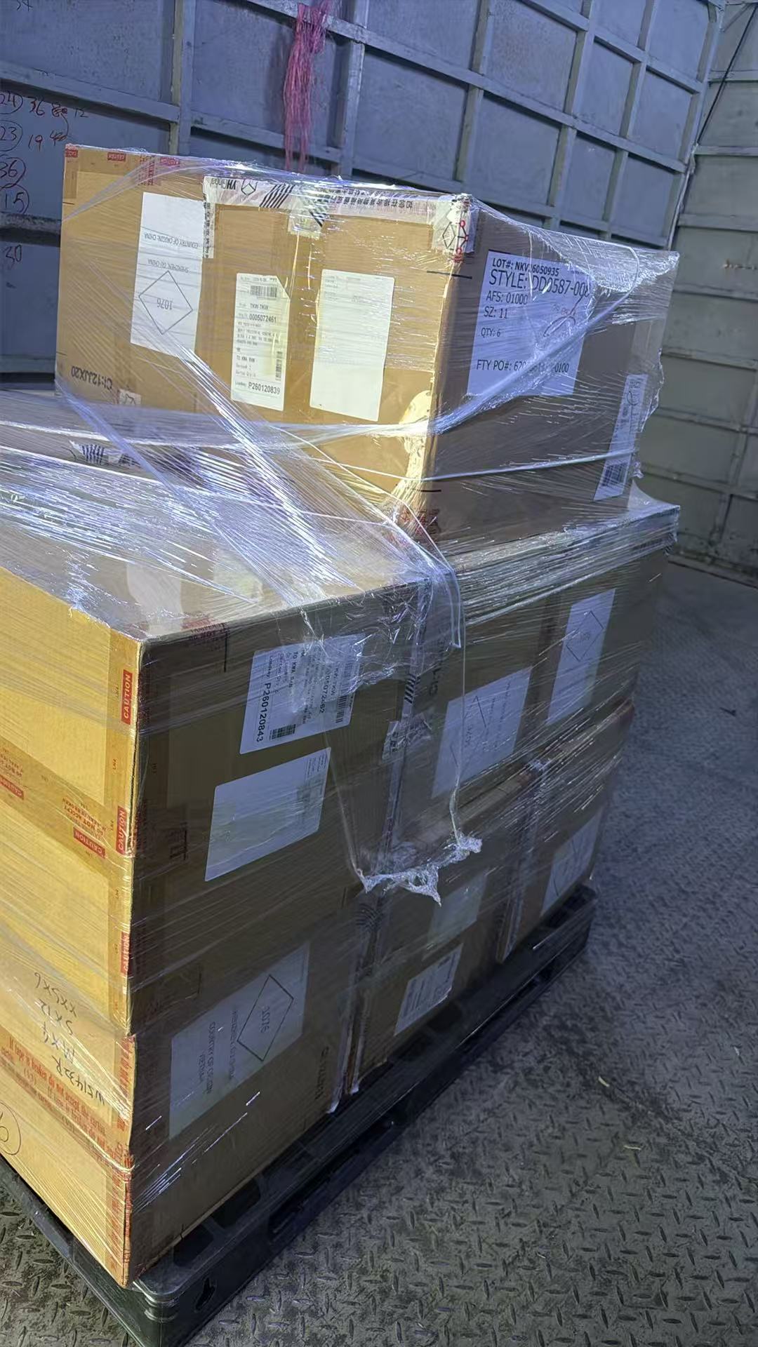 Wrapped footwear cartons prepared for warehouse dispatch in China