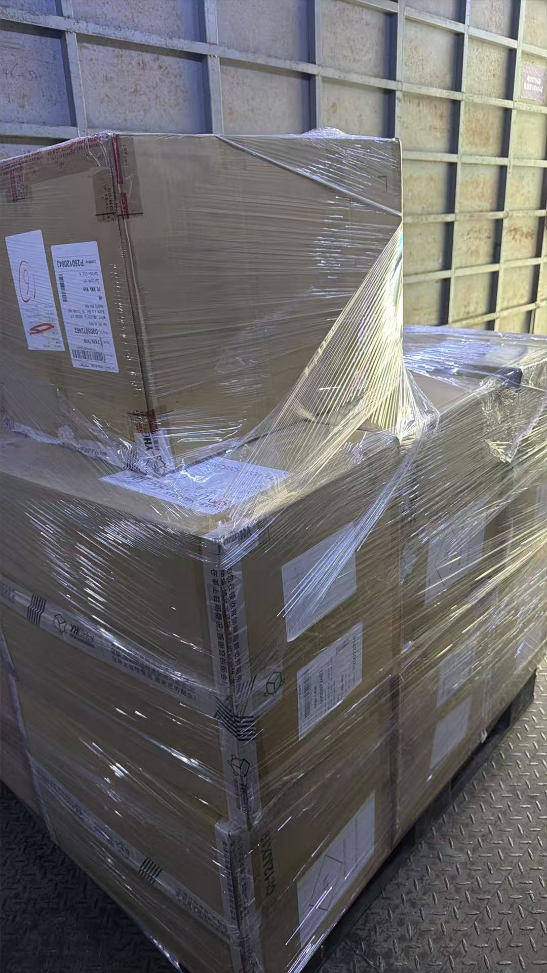 Multiple wrapped cartons staged together for footwear shipment