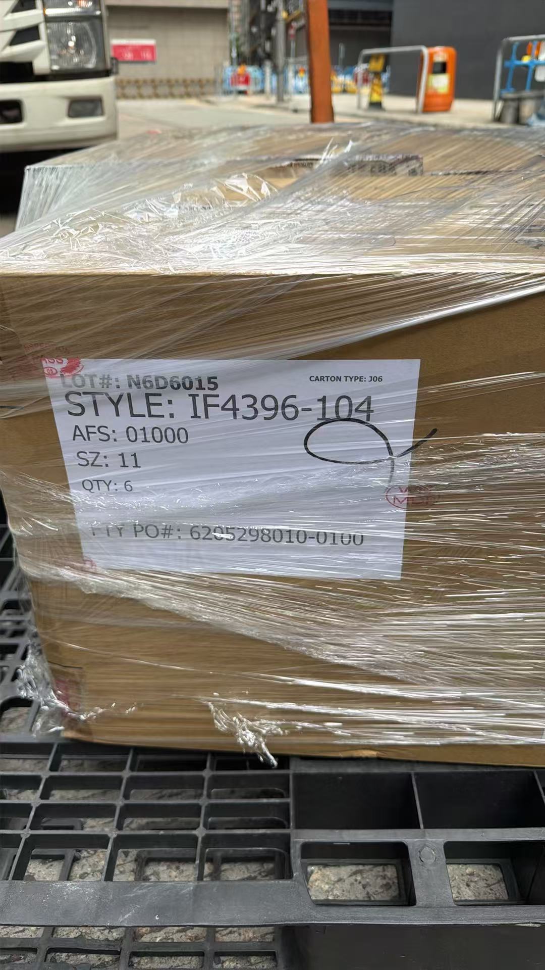 Close view of a labeled footwear shipping carton ready for dispatch